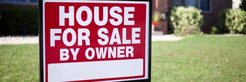 7 Factors Impacting the Future of FSBO Real Estate 1 House for Sale By Owner sign on a lawn in front of a house